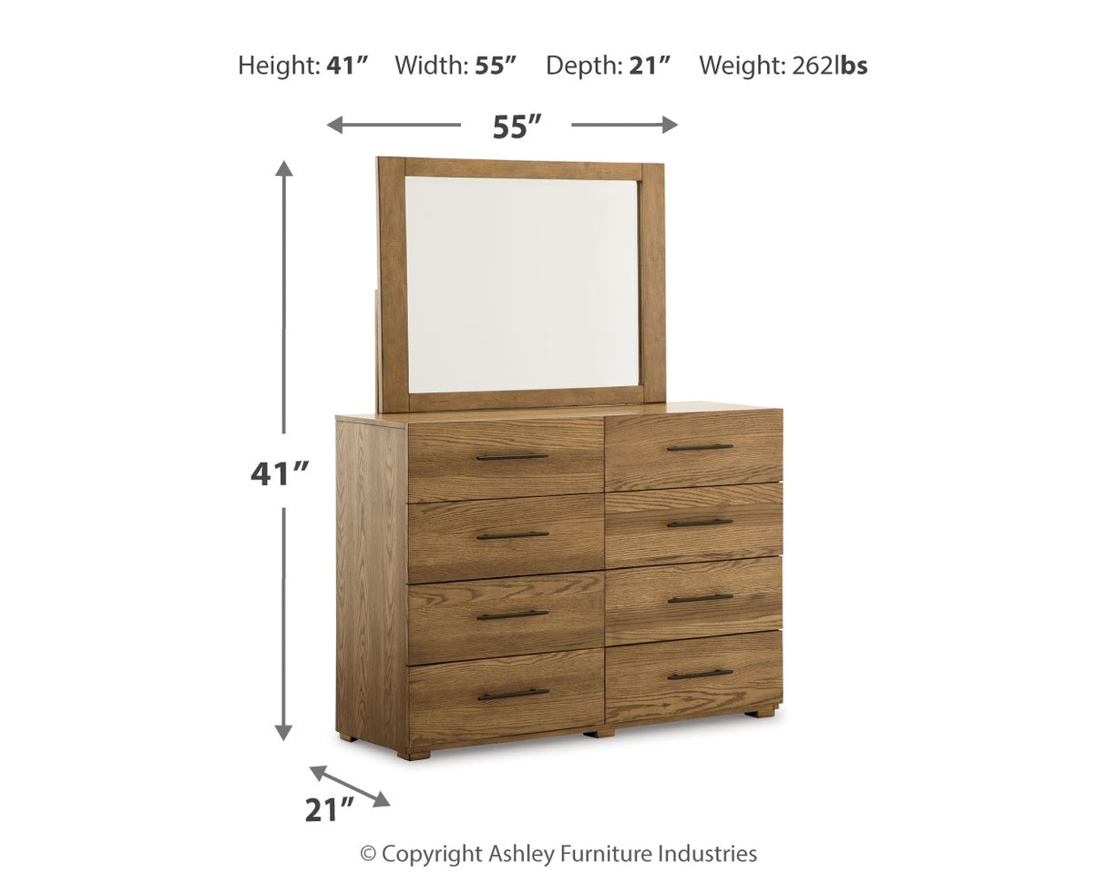 Brown Dakmore California King Upholstered Bed with Mirrored Dresser, Chest and 2 Nightstands - PKG014666