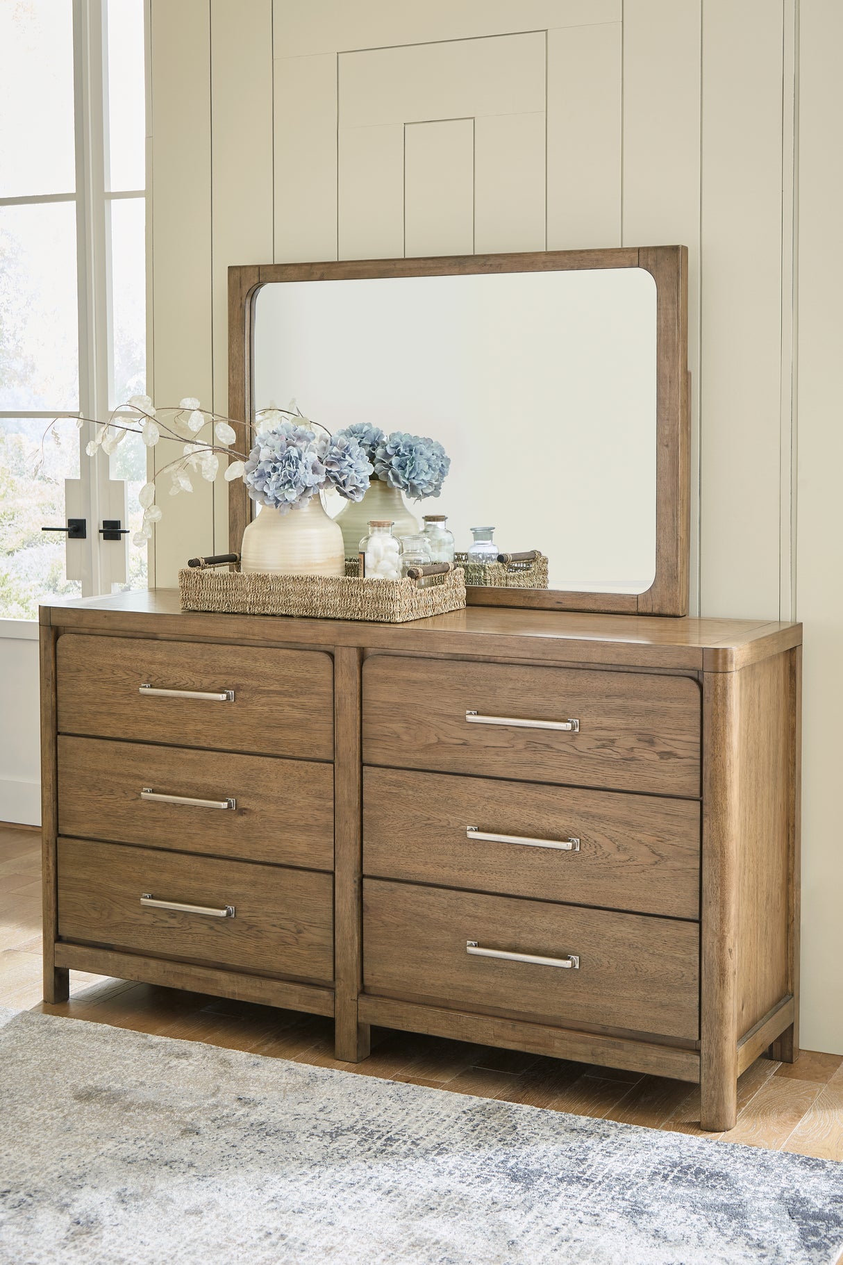 Cabalynn California King Panel Bed with Storage with Mirrored Dresser, Chest and Nightstand in Light Brown - PKG015751