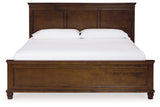 Danabrin King Panel Bed with Mirrored Dresser and Chest in Brown - PKG015185