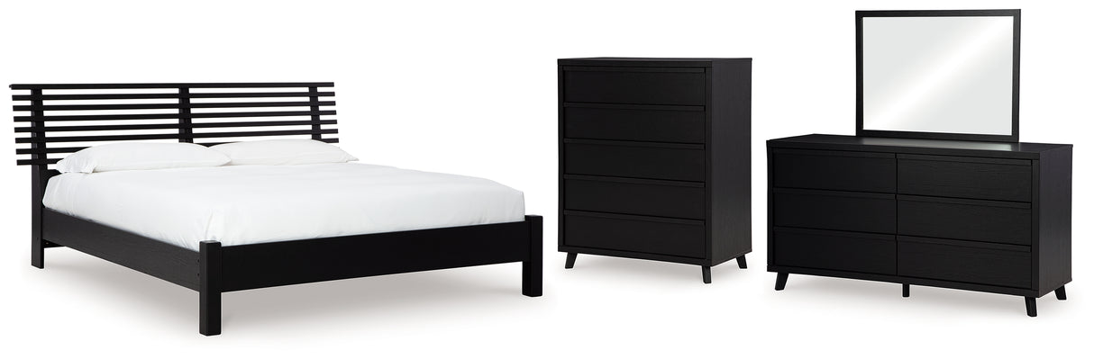 Danziar King Panel Bed with Mirrored Dresser and Chest in Black from Ashley - Luna Furniture