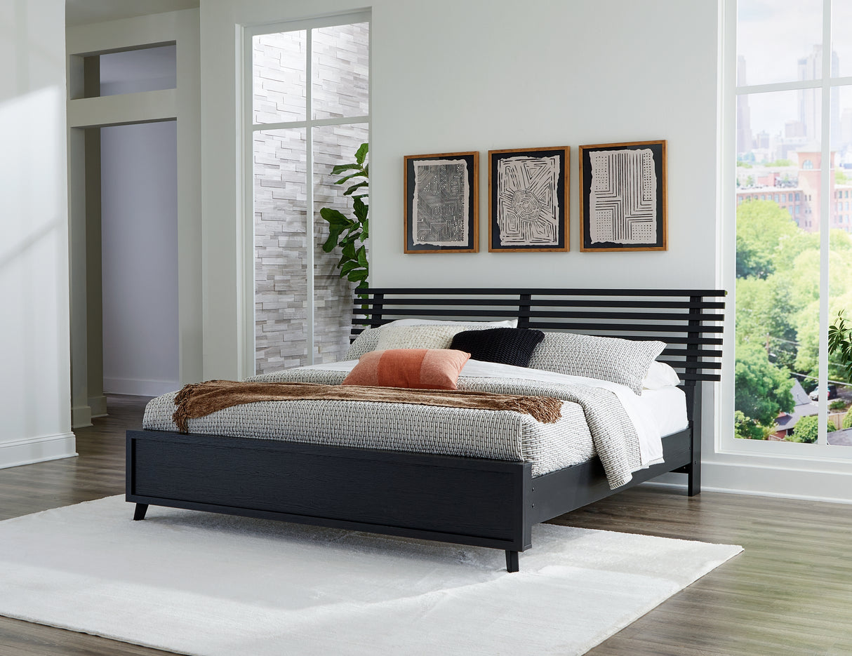 Danziar King Panel Bed with Mirrored Dresser and Chest in Black from Ashley - Luna Furniture