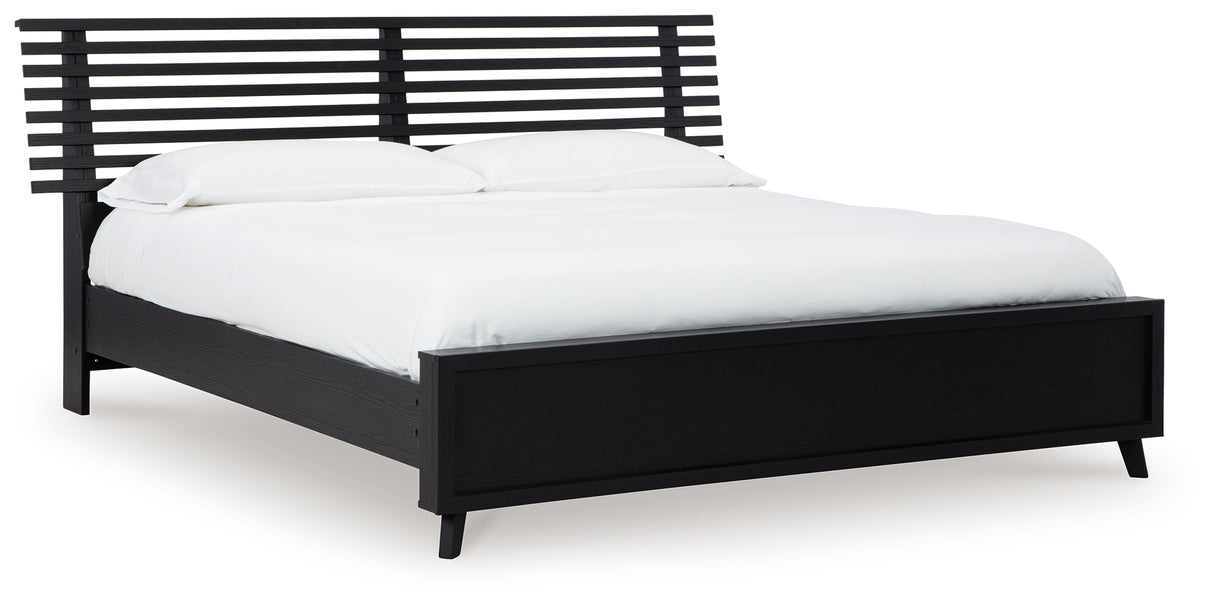 Danziar King Panel Bed with Mirrored Dresser and Chest in Black from Ashley - Luna Furniture