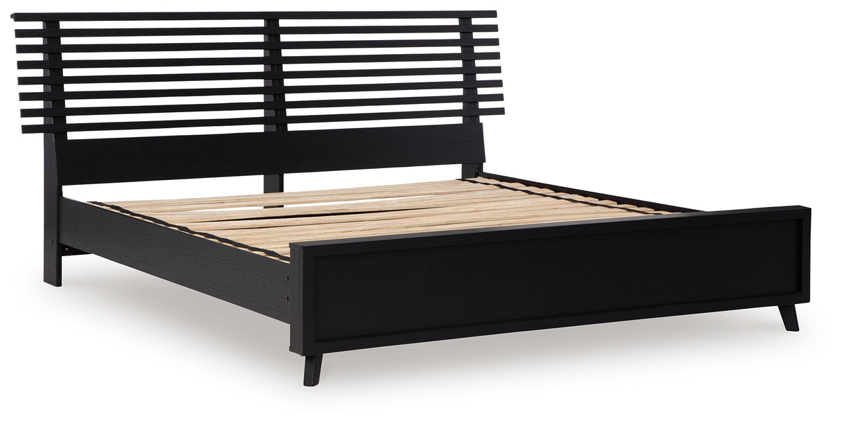 Danziar King Panel Bed with Mirrored Dresser and Chest in Black from Ashley - Luna Furniture