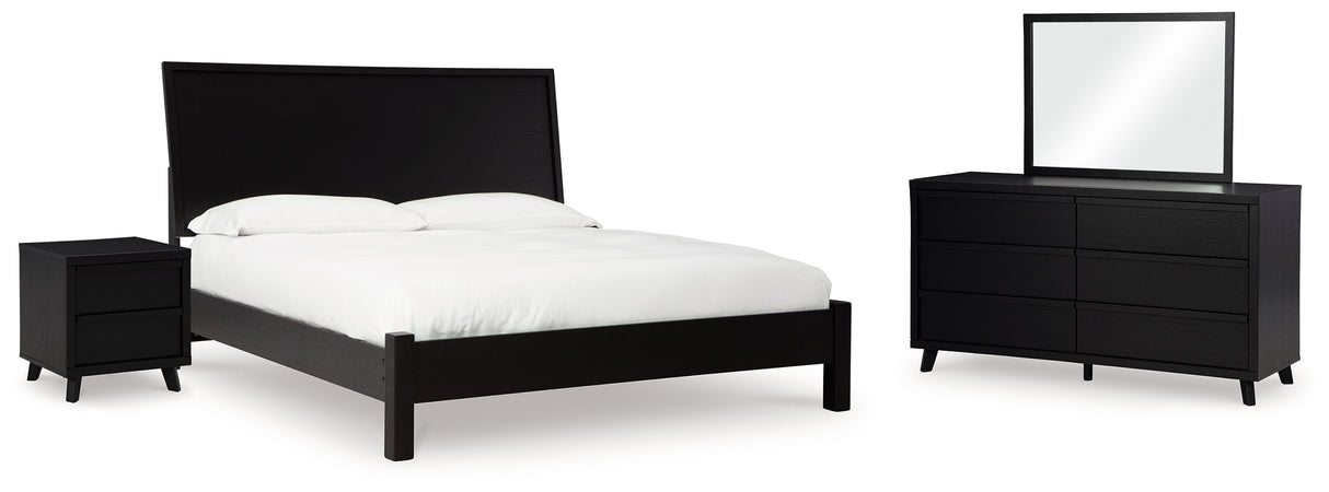 Danziar King Panel Bed with Mirrored Dresser and Nightstand in Black - PKG015886