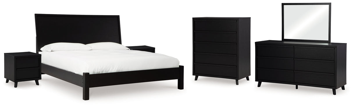 Danziar King Panel Bed with Mirrored Dresser, Chest and 2 Nightstands in Black from Ashley - Luna Furniture