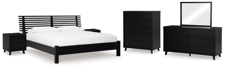 Danziar King Panel Bed with Mirrored Dresser, Chest and 2 Nightstands in Black from Ashley - Luna Furniture