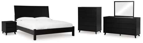 Danziar King Panel Bed with Mirrored Dresser, Chest and Nightstand in Black - PKG015888