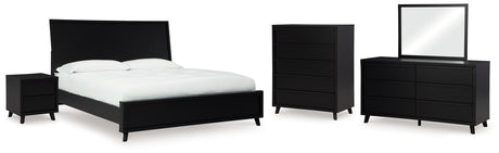 Danziar King Panel Bed with Mirrored Dresser, Chest and Nightstand in Black - PKG015918