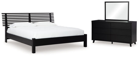 Danziar King Panel Bed with Mirrored Dresser in Black from Ashley - Luna Furniture