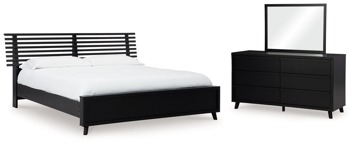 Danziar King Panel Bed with Mirrored Dresser in Black from Ashley - Luna Furniture