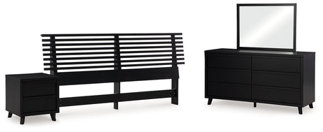 Danziar King Panel Headboard with Mirrored Dresser and Nightstand in Black from Ashley - Luna Furniture