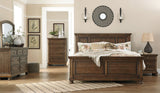 Flynnter California King Panel Bed with Mirrored Dresser, Chest and Nightstand in Medium Brown from Ashley - Luna Furniture