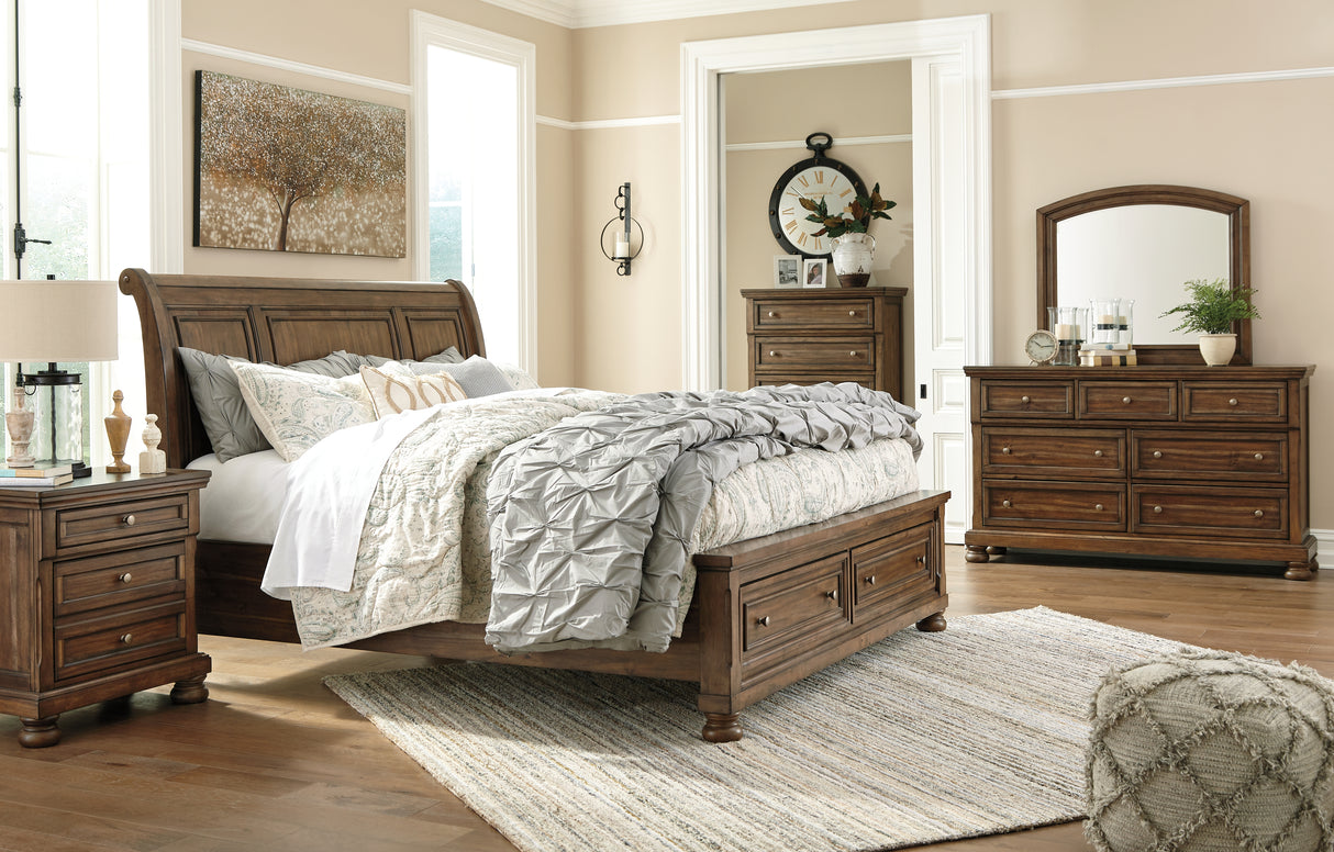 Flynnter California King Sleigh Bed with 2 Storage Drawers with Mirrored Dresser, Chest and Nightstand in Medium Brown from Ashley - Luna Furniture