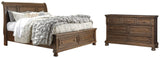 Flynnter King Sleigh Bed with 2 Storage Drawers with Dresser in Medium Brown from Ashley - Luna Furniture