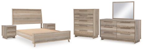 Hasbrick Queen Panel Bed with Mirrored Dresser, Chest and 2 Nightstands in Tan from Ashley - Luna Furniture