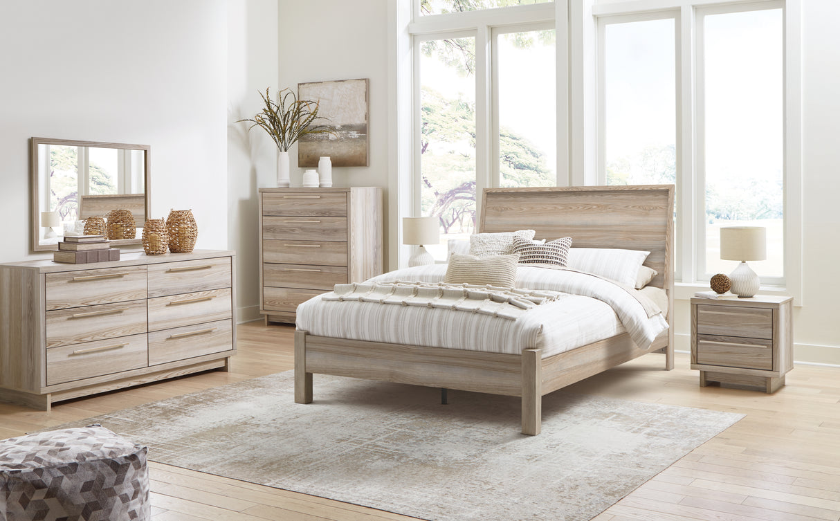 Hasbrick Queen Panel Bed with Mirrored Dresser, Chest and 2 Nightstands in Tan from Ashley - Luna Furniture