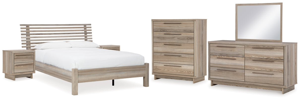 Hasbrick Queen Panel Bed with Mirrored Dresser, Chest and 2 Nightstands in Tan from Ashley - Luna Furniture