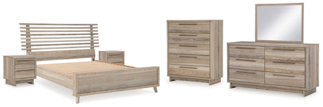 Hasbrick Queen Panel Bed with Mirrored Dresser, Chest and 2 Nightstands in Tan from Ashley - Luna Furniture