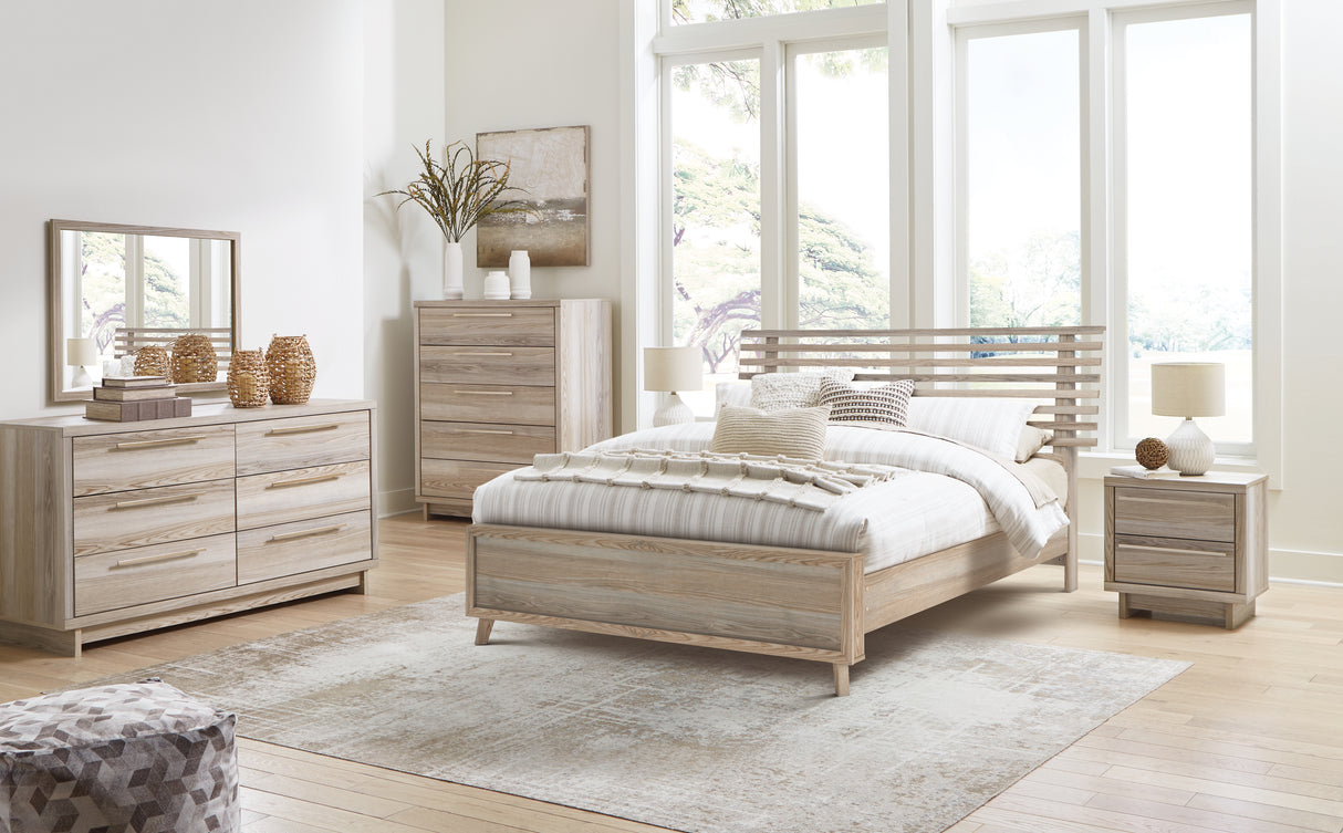 Hasbrick Queen Panel Bed with Mirrored Dresser, Chest and 2 Nightstands in Tan from Ashley - Luna Furniture