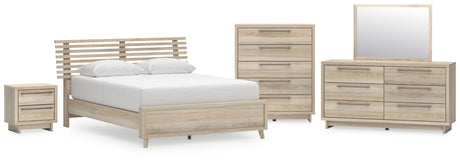 Hasbrick Queen Panel Bed with Mirrored Dresser, Chest and Nightstand in Tan from Ashley - Luna Furniture