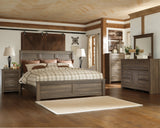 Juararo California King Panel Bed with Mirrored Dresser, Chest and 2 Nightstands in Dark Brown - PKG004058