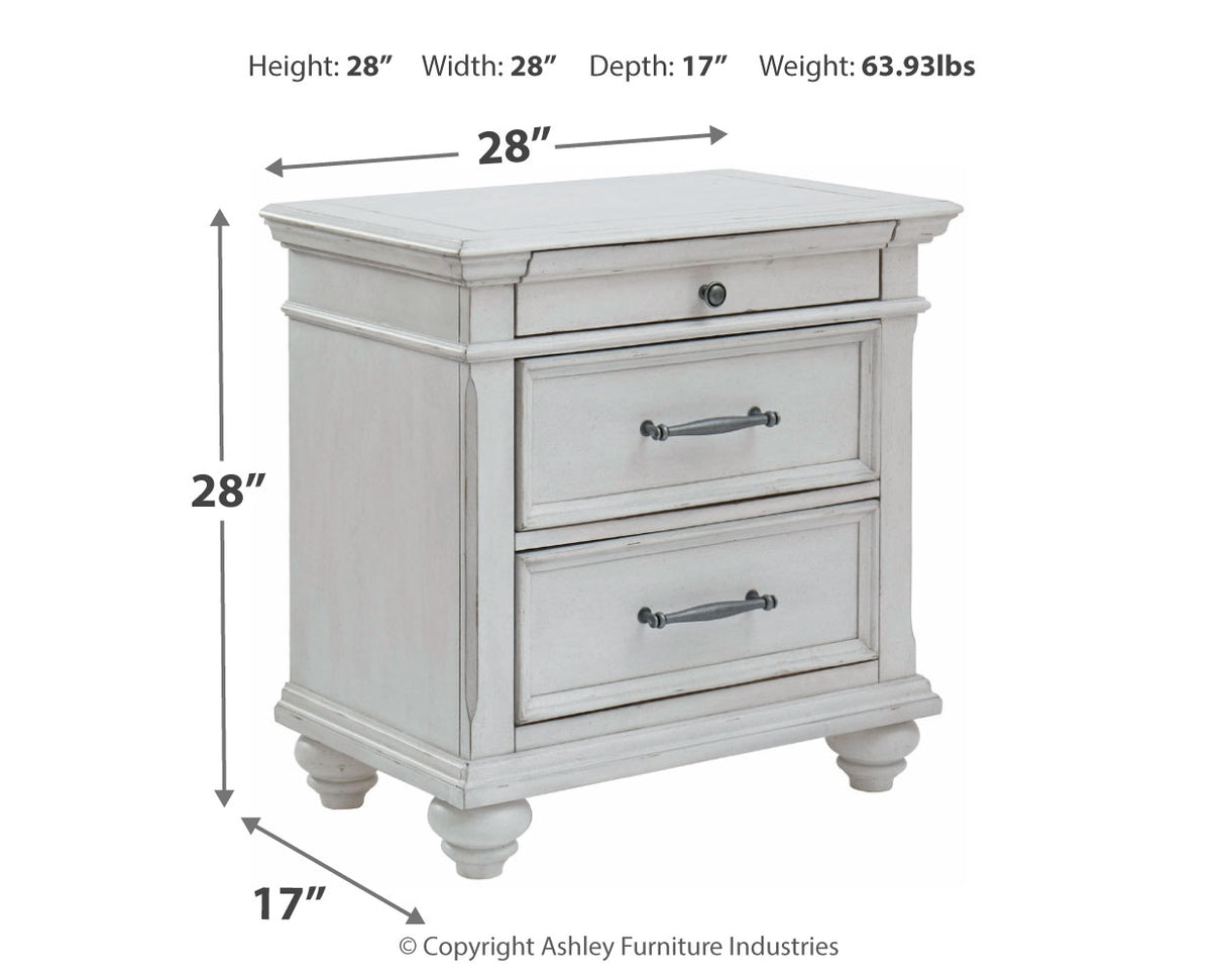 Kanwyn King Panel Bed with Mirrored Dresser, Chest and 2 Nightstands in Whitewash - PKG007947