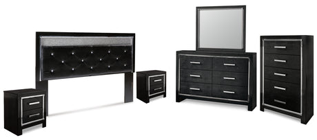 Kaydell King Upholstered Panel Headboard with Mirrored Dresser, Chest and 2 Nightstands in Black - PKG014238