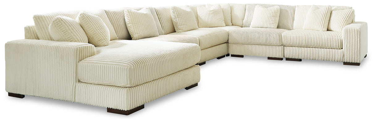 Lindyn 6-Piece Sectional with Ottoman in Ivory - PKG016103