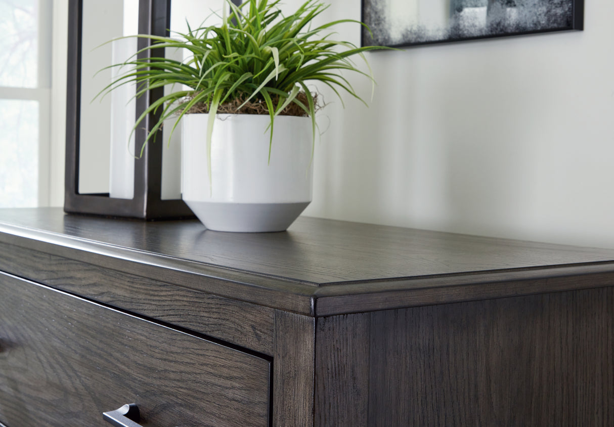 Montillan King Panel Bed with Mirrored Dresser, Chest and Nightstand in Grayish Brown from Ashley - Luna Furniture