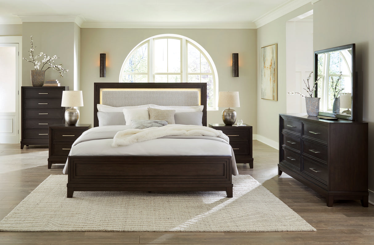 Neymorton California King Upholstered Panel Bed with Mirrored Dresser and 2 Nightstands in Dark Grayish Brown from Ashley - Luna Furniture