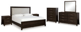 Neymorton California King Upholstered Panel Bed with Mirrored Dresser, Chest and 2 Nightstands in Dark Grayish Brown from Ashley - Luna Furniture