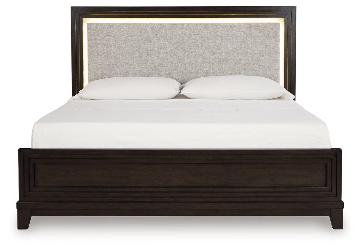 Neymorton California King Upholstered Panel Bed with Mirrored Dresser in Dark Grayish Brown from Ashley - Luna Furniture