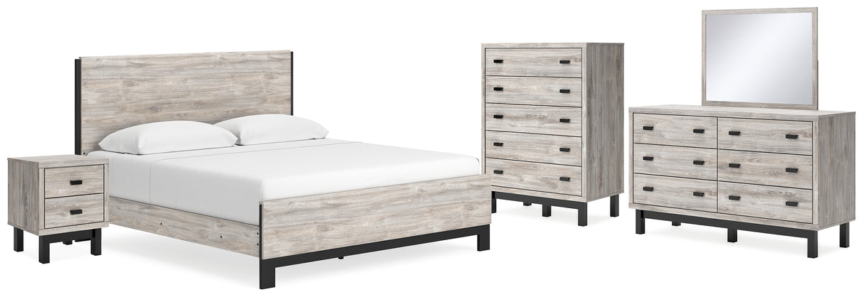 Vessalli King Panel Bed with Mirrored Dresser, Chest and Nightstand in Gray from Ashley - Luna Furniture