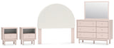 Wistenpine Full Upholstered Panel Headboard with Mirrored Dresser and 2 Nightstands in Blush - PKG018931