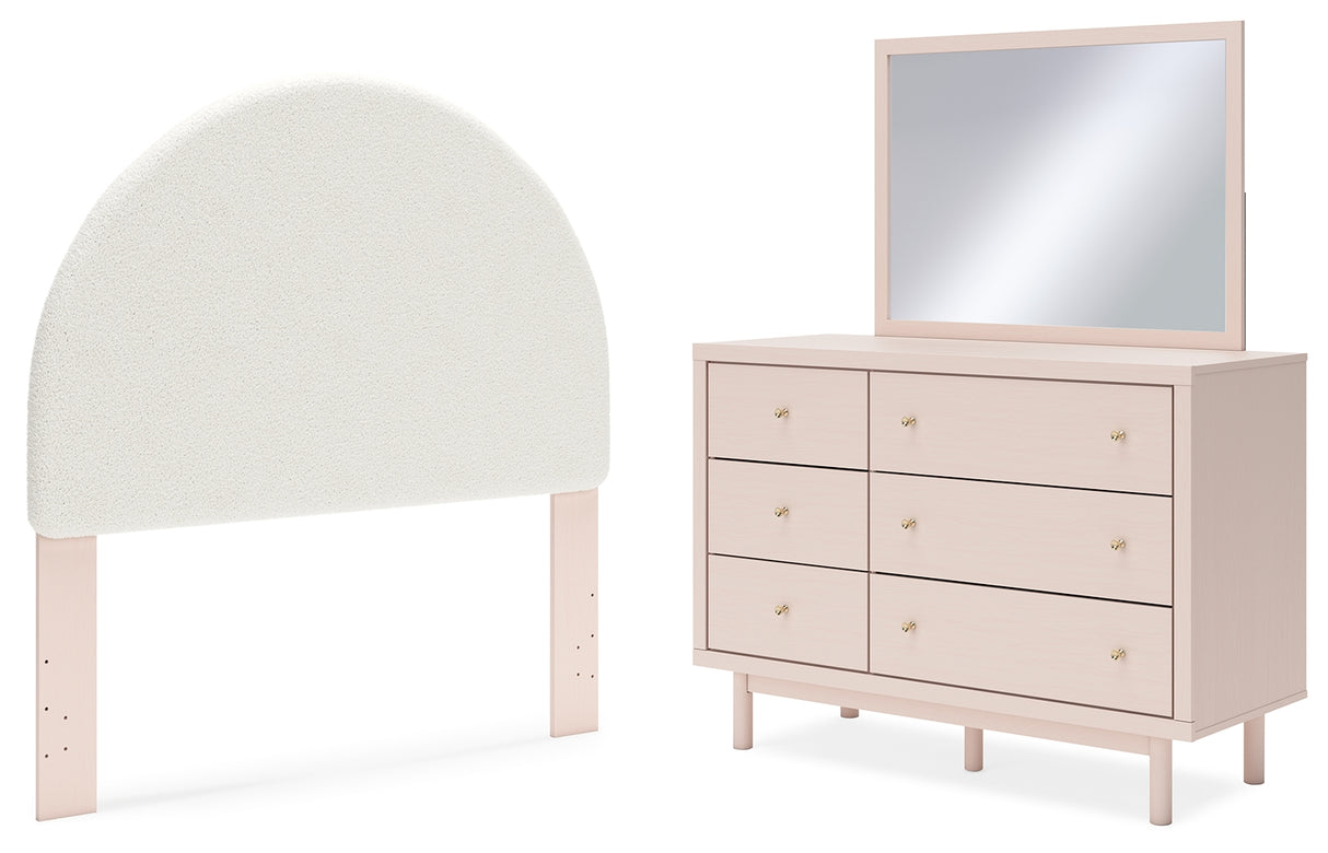 Wistenpine Full Upholstered Panel Headboard with Mirrored Dresser in Blush - PKG018712