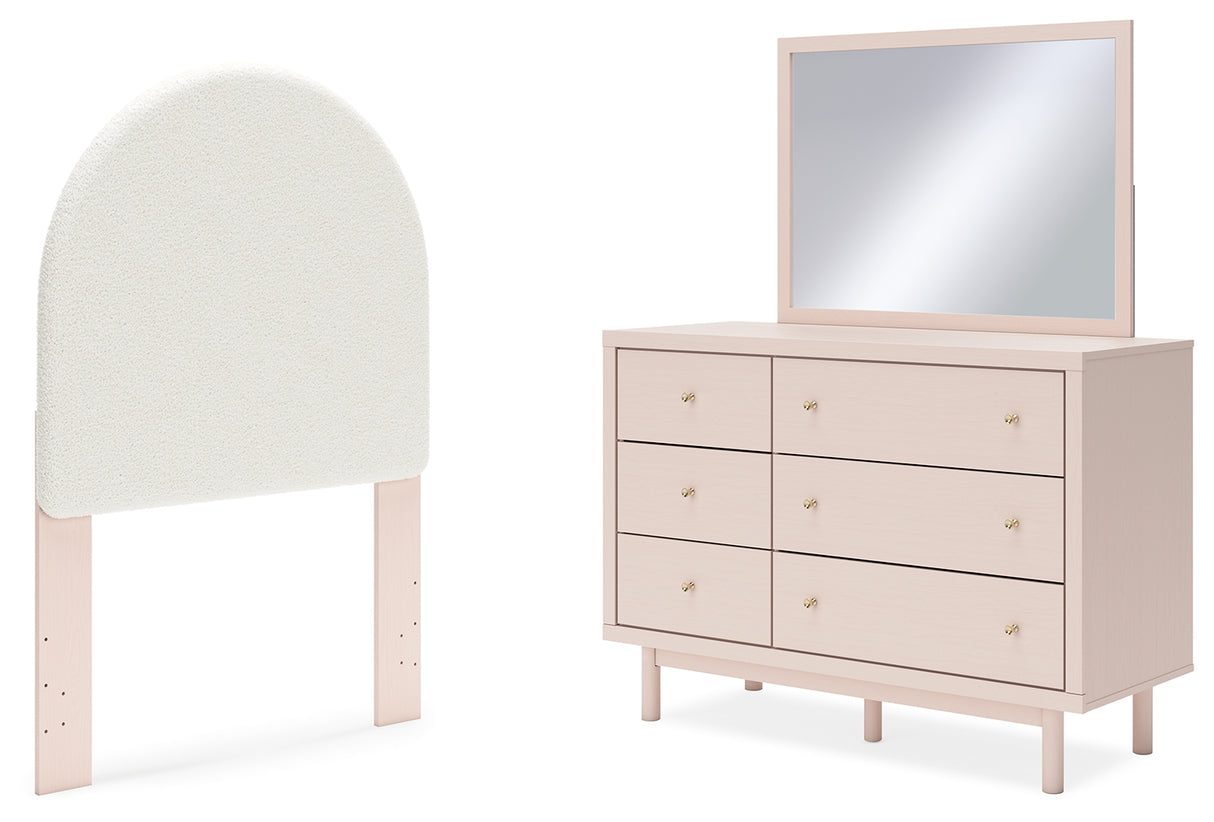 Wistenpine Twin Upholstered Panel Headboard with Mirrored Dresser in Blush - PKG018707