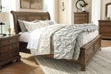 Flynnter Medium Brown Queen Sleigh Bed with 2 Storage Drawers from Ashley - Luna Furniture