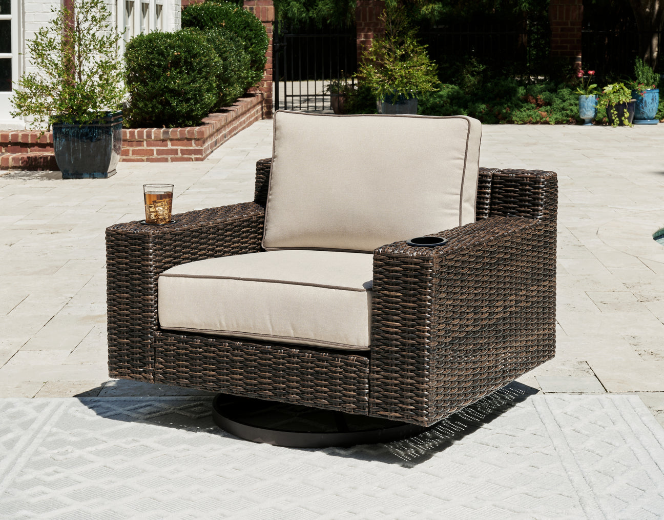 Coastline Bay Brown Outdoor Swivel Lounge with Cushion from Ashley - Luna Furniture