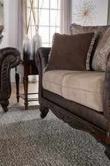 Elmbrook Upholstered Rolled Arm Loveseat with Intricate Wood Carvings Brown - 508572 - Luna Furniture