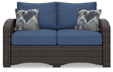 Windglow Blue/Brown Outdoor Loveseat with Cushion from Ashley - Luna Furniture